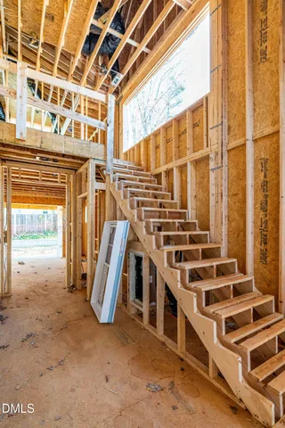 a view of a room with wooden walls and floor