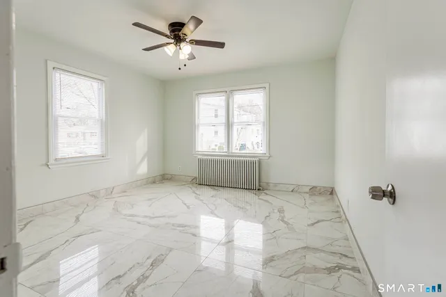 a view of an empty room with a window