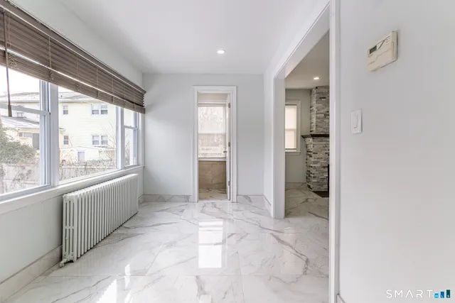 a view of an empty room and window