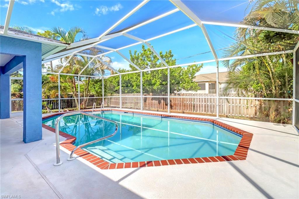 18250 Maple Road Fort Myers, FL 33967 - Photo 23 of 26 a view of a backyard with a swimming pool