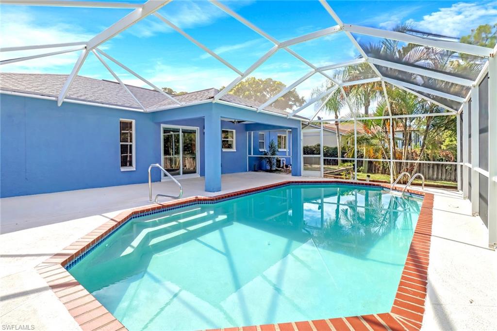 18250 Maple Road Fort Myers, FL 33967 - Photo 24 of 26 a view of a swimming pool with a patio