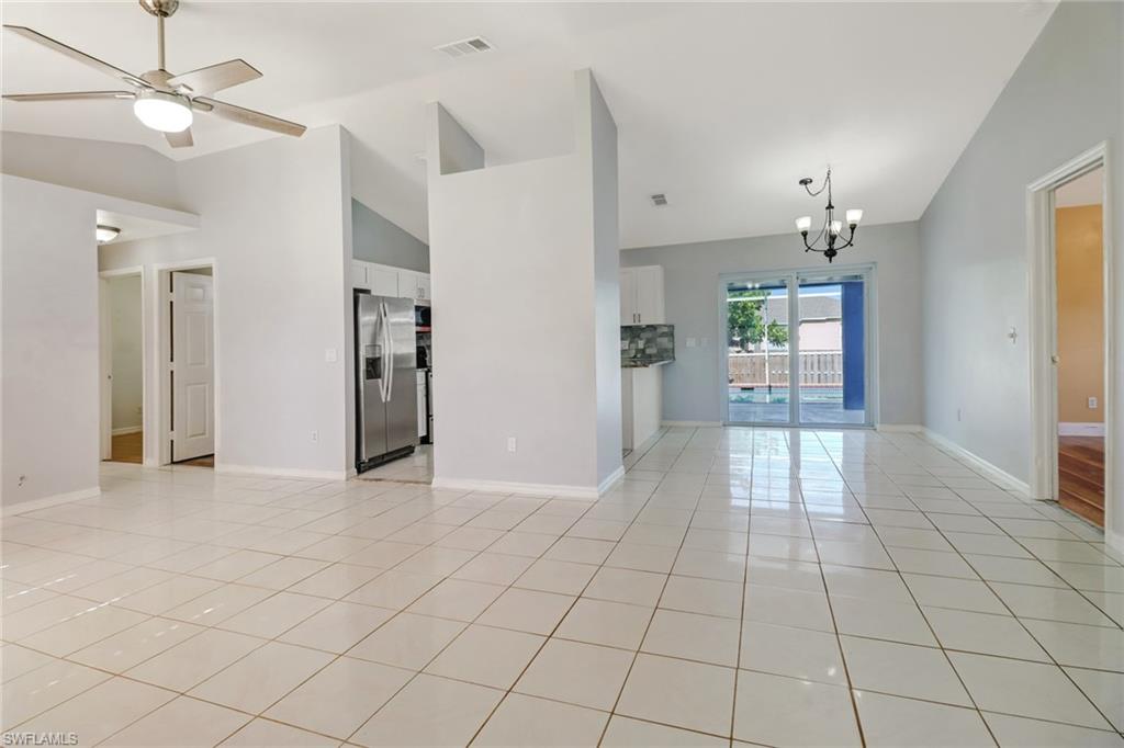 18250 Maple Road Fort Myers, FL 33967 - Photo 4 of 26 an empty room with closet and a chandelier fan