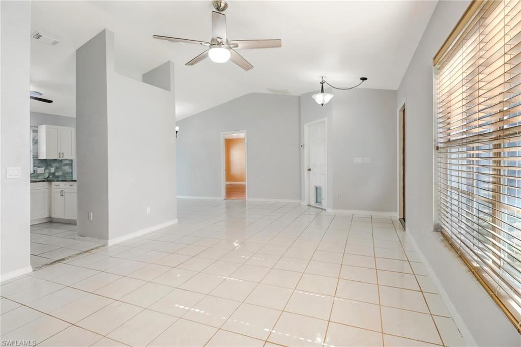 18250 Maple Road Fort Myers, FL 33967 - Photo 5 of 26 an empty room with fan and windows