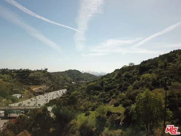 an aerial view of mountain with trees
