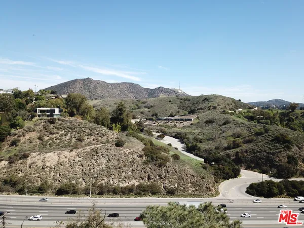 front view of a house with a mountain