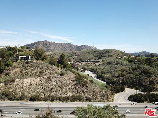 front view of a house with a mountain