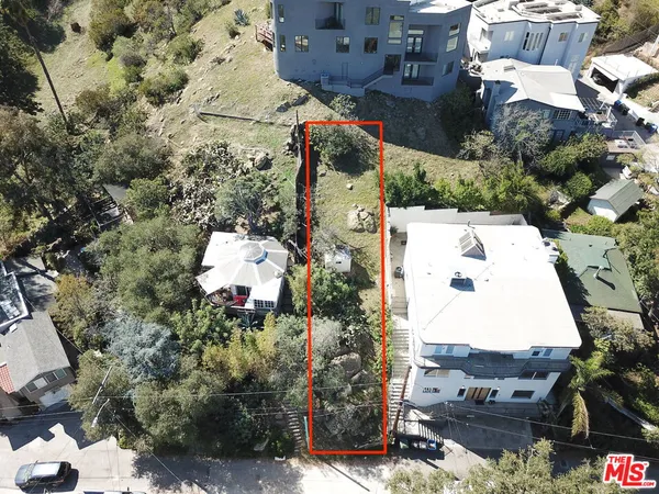 an aerial view of residential house with outdoor space