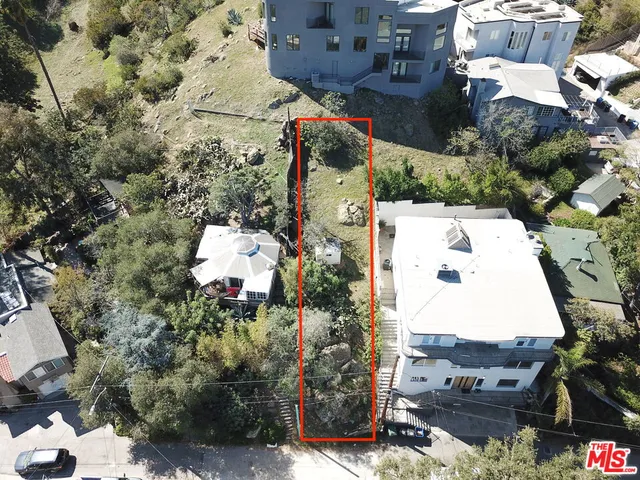 an aerial view of residential house with outdoor space