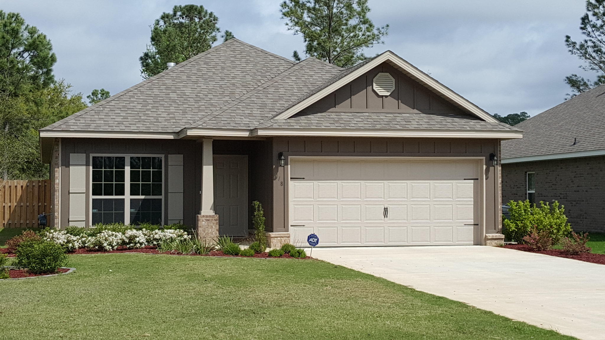 41 Twain Trail Freeport, FL 32439 - Photo 1 of 19 a front view of a house with a garden