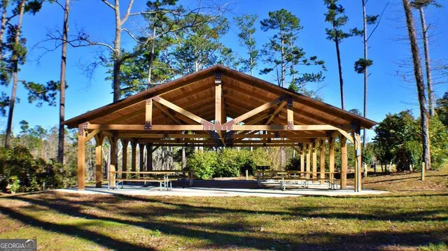 a view of a house with a yard patio and deck