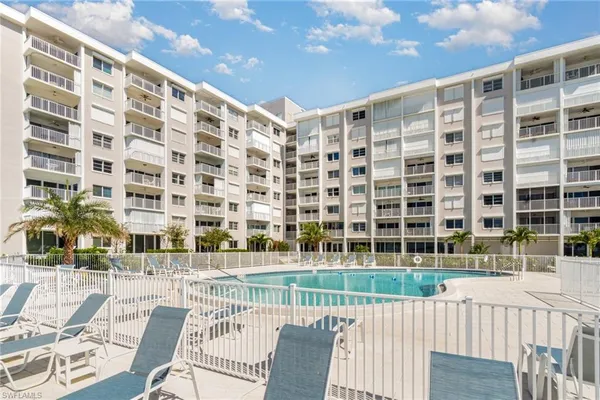 a view of a building with a backyard