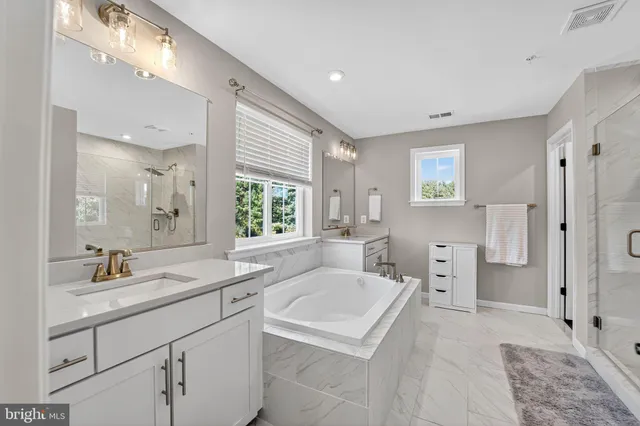 a bedroom with a bed and a ceiling fan