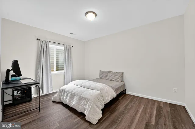 a bathroom with a sink toilet tub and shower