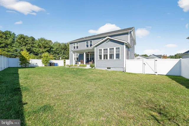 a view of a house with a yard and plants