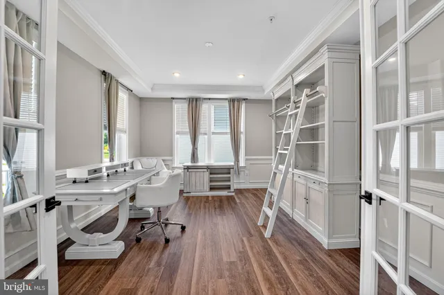 a view of a livingroom with furniture wooden floor and a window