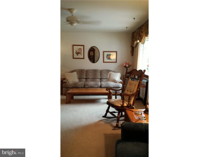 1156 Norwalk Road Philadelphia, PA 19115 - Photo 3 of 23 a living room with furniture and a window