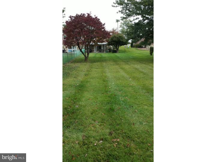 1156 Norwalk Road Philadelphia, PA 19115 - Photo 22 of 23 a backyard of a house with lots of green space