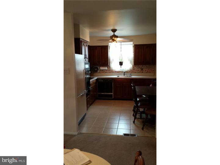 1156 Norwalk Road Philadelphia, PA 19115 - Photo 8 of 23 a bathroom with a sink and a mirror