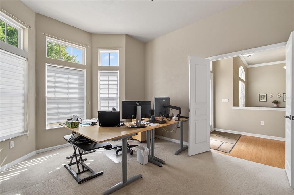 3762 Southwest 74th Drive Gainesville, FL 32608 - Photo 19 of 37 a view of a workspace with furniture and a window