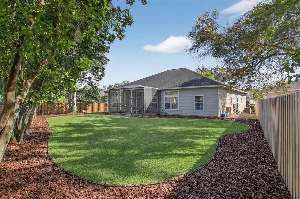 3762 Southwest 74th Drive Gainesville, FL 32608 - Photo 20 of 37 a view of a house with a backyard