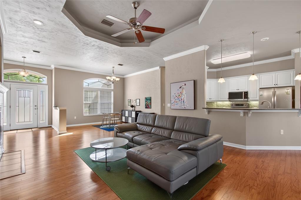 3762 Southwest 74th Drive Gainesville, FL 32608 - Photo 28 of 37 a living room with furniture and a wooden floor