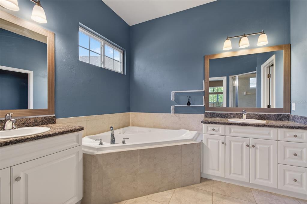 3762 Southwest 74th Drive Gainesville, FL 32608 - Photo 6 of 37 a bath tub sitting next to a bathroom sink