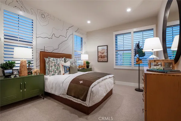 a bedroom with a bed and a table