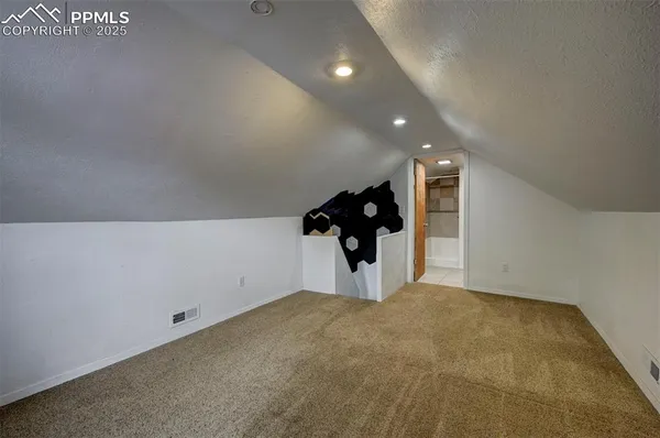 a bedroom with a bed and cabinets