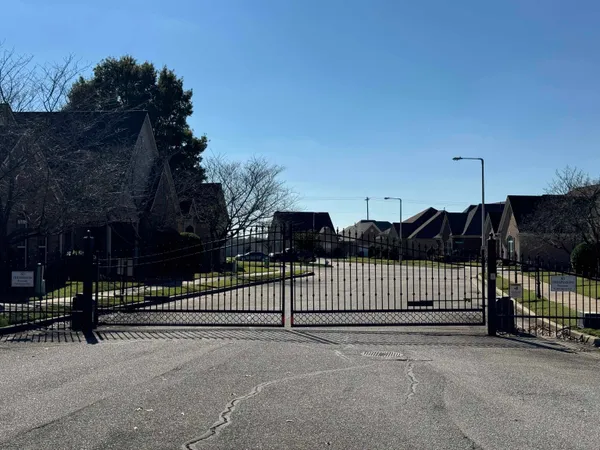 a view of a wrought iron fences in front of house
