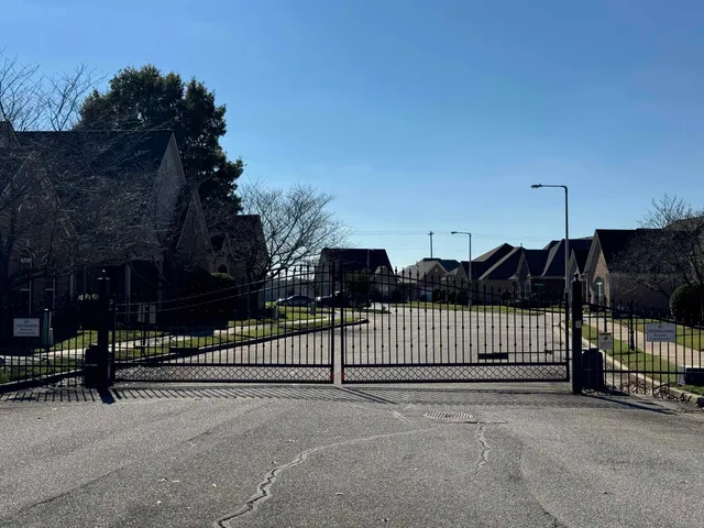 a view of a wrought iron fences in front of house