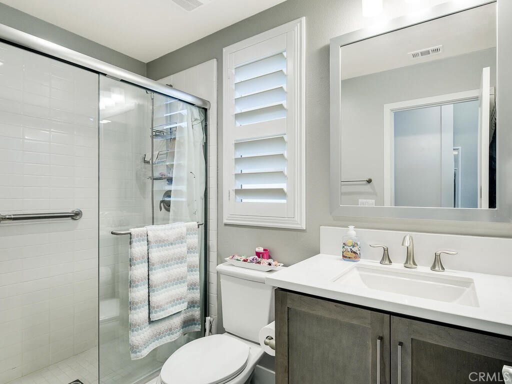 374 Ventasso Way Fallbrook, CA 92028 - Photo 13 of 42 a bathroom with a sink vanity mirror and toilet
