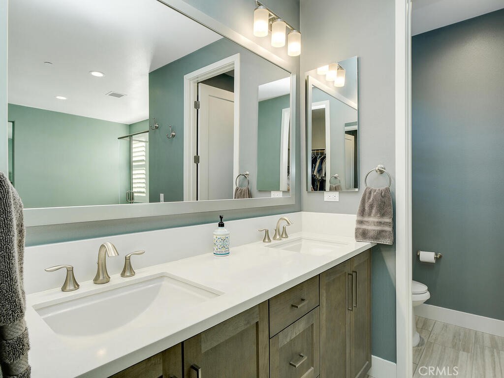 374 Ventasso Way Fallbrook, CA 92028 - Photo 24 of 42 a bathroom with a sink vanity and a mirror