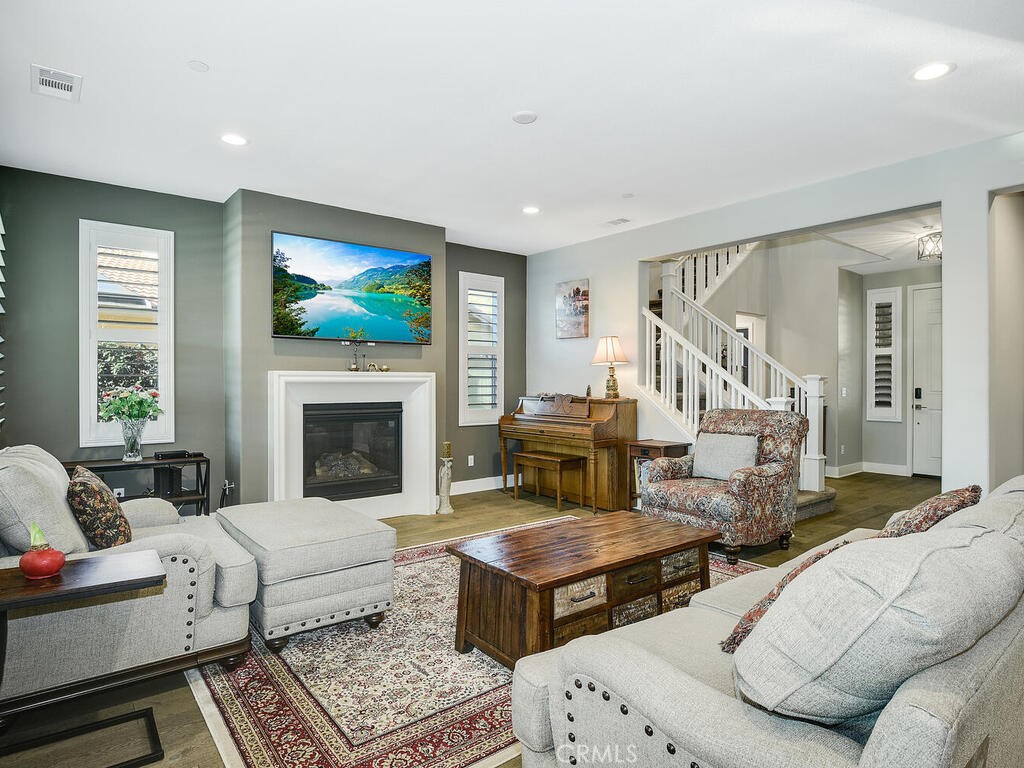 374 Ventasso Way Fallbrook, CA 92028 - Photo 5 of 42 a living room with furniture fireplace and window