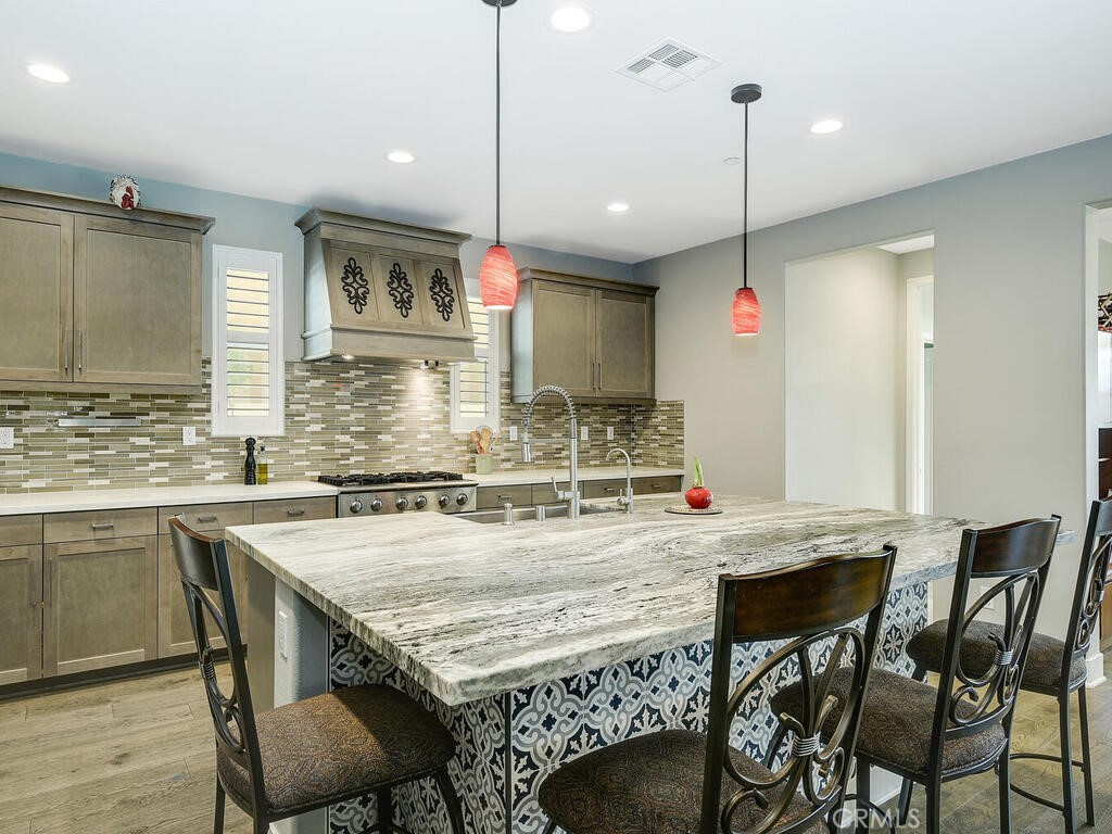 374 Ventasso Way Fallbrook, CA 92028 - Photo 8 of 42 a kitchen with a table and chairs in it