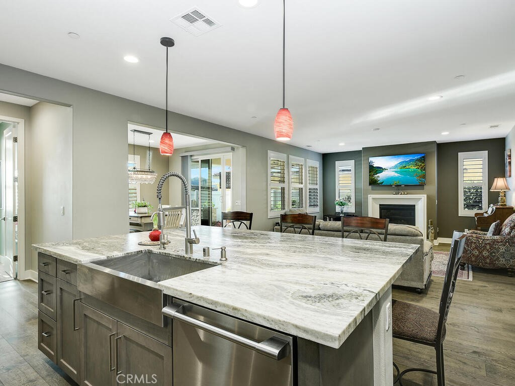 374 Ventasso Way Fallbrook, CA 92028 - Photo 9 of 42 a kitchen with granite countertop a table and chairs