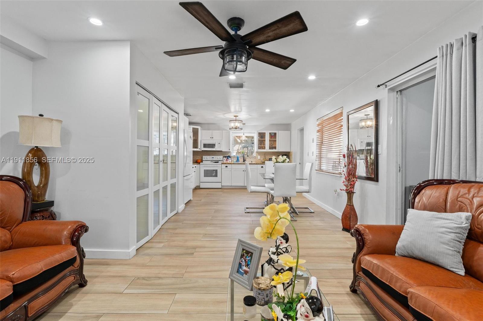 580 East 44th Street Hialeah, FL 33013 - Photo 15 of 41 a living room with furniture and kitchen view