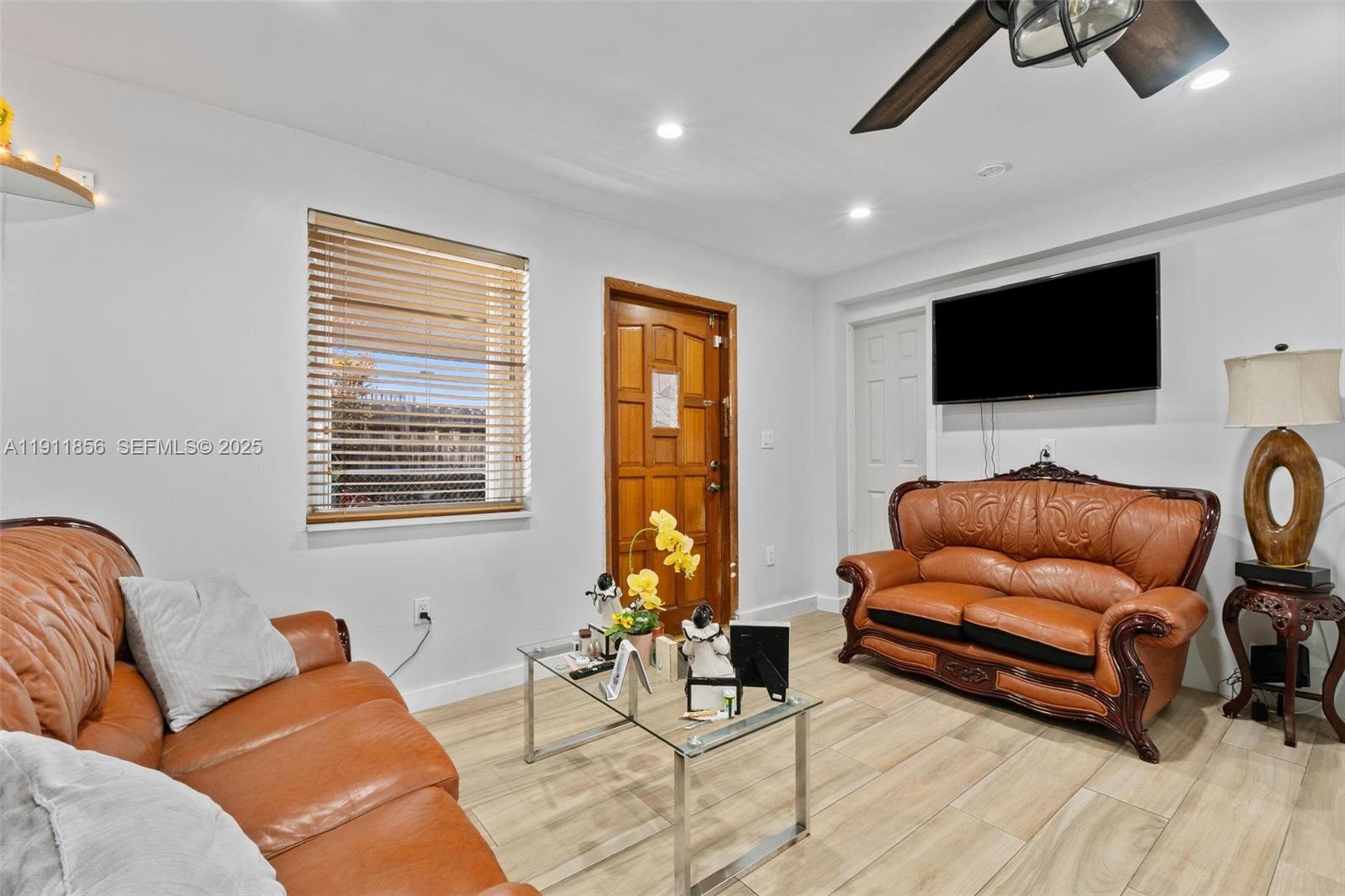 580 East 44th Street Hialeah, FL 33013 - Photo 16 of 41 a living room with furniture and a flat screen tv