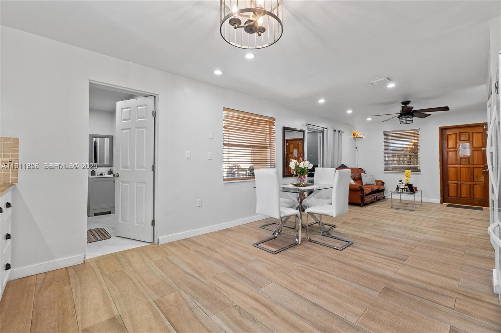 580 East 44th Street Hialeah, FL 33013 - Photo 20 of 41 a view of a dining room with furniture and a chandelier
