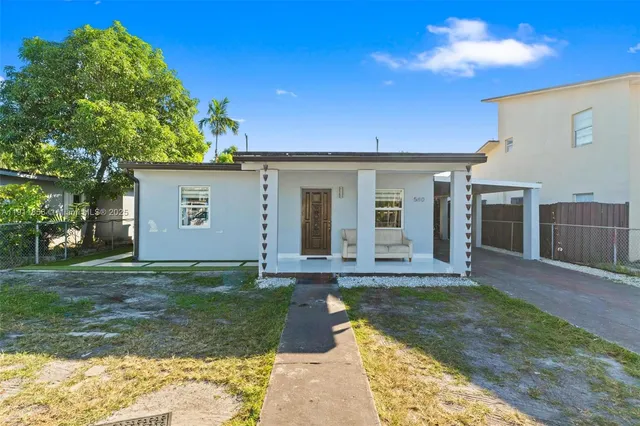 front view of a house with a yard