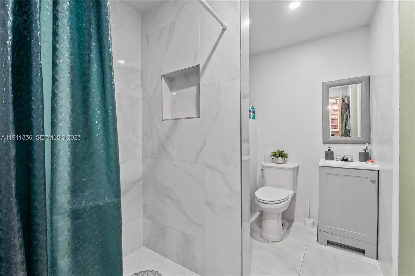 580 East 44th Street Hialeah, FL 33013 - Photo 21 of 41 a bathroom with a sink a toilet and shower