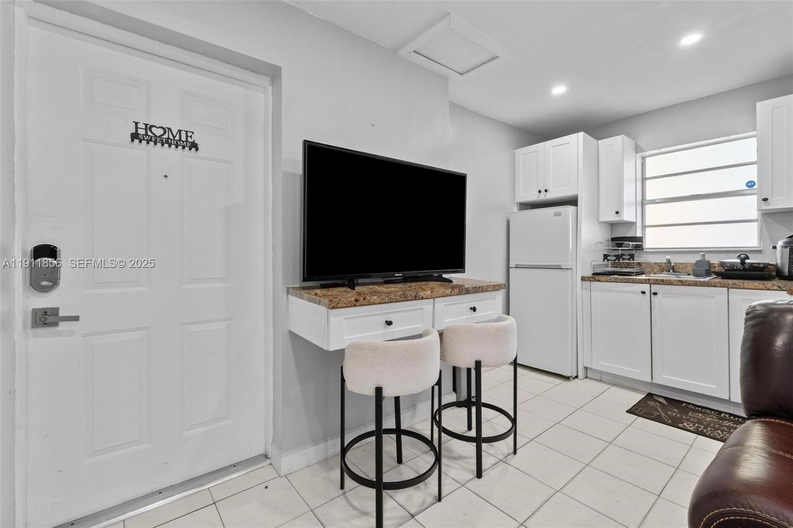 580 East 44th Street Hialeah, FL 33013 - Photo 24 of 41 a kitchen with stainless steel appliances a stove a sink and a refrigerator