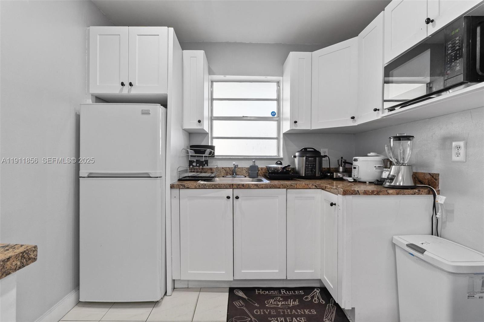 580 East 44th Street Hialeah, FL 33013 - Photo 25 of 41 a kitchen with stainless steel appliances a refrigerator and cabinets