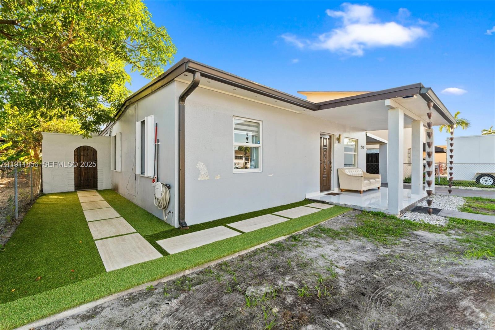 580 East 44th Street Hialeah, FL 33013 - Photo 3 of 41 a view of a house with a yard