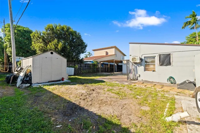 a house with trees in the background