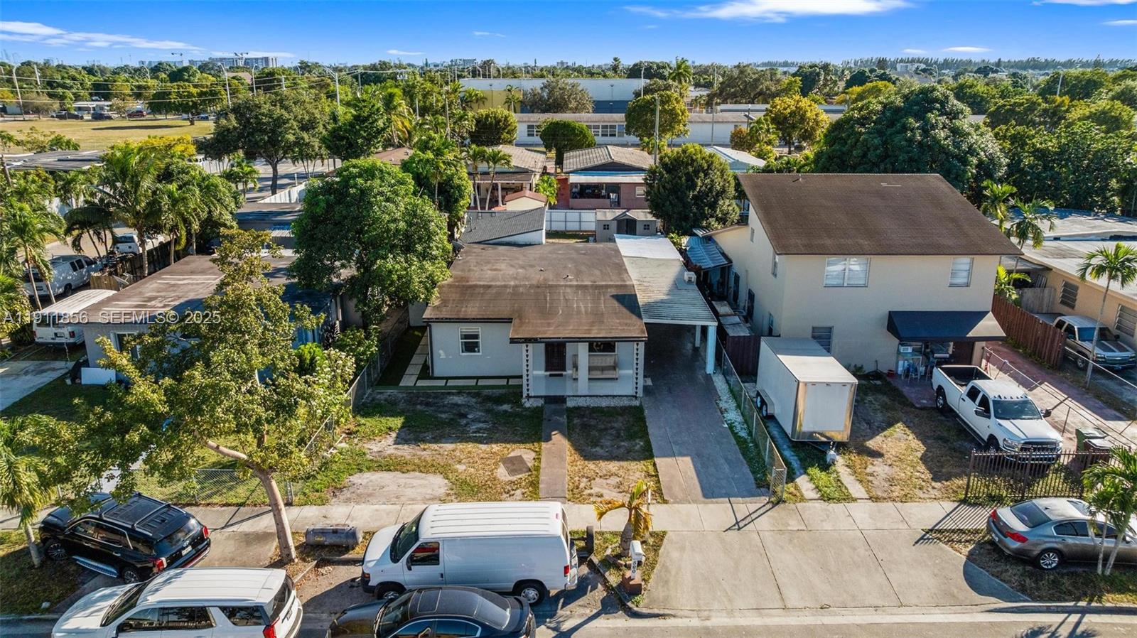 580 East 44th Street Hialeah, FL 33013 - Photo 40 of 41 an aerial view of a houses with a yard