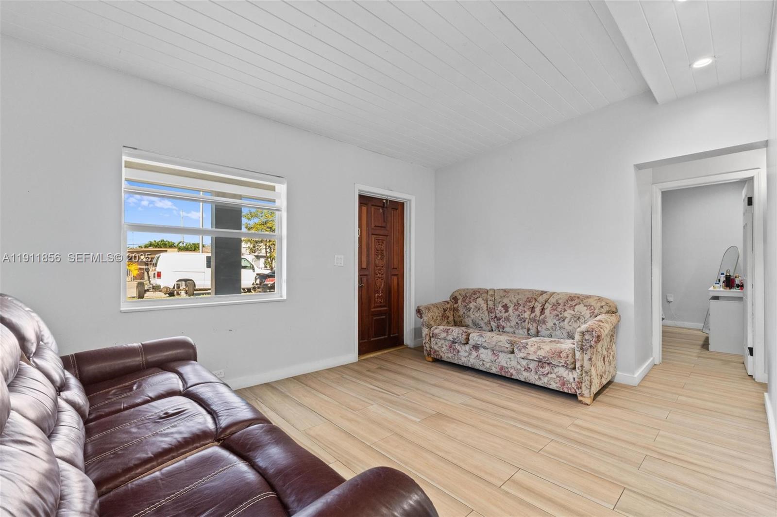 580 East 44th Street Hialeah, FL 33013 - Photo 5 of 41 a living room with furniture and a window