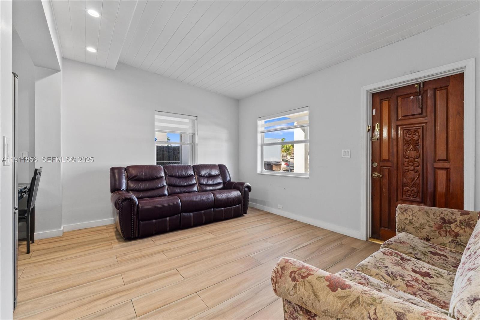 580 East 44th Street Hialeah, FL 33013 - Photo 6 of 41 a living room with a bed furniture and a window