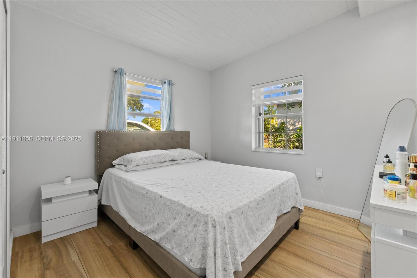 580 East 44th Street Hialeah, FL 33013 - Photo 10 of 41 a bedroom with a bed and painting on the wall