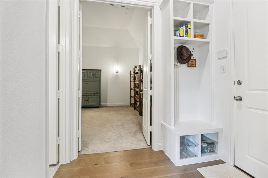 8277 Halifax The Colony, TX 75056 - Photo 28 of 37 a view of a hallway with storage and utility