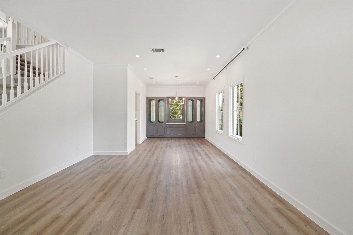 5700 Carry Back Lane Austin, TX 78746 - Photo 16 of 40 wooden floor in an empty room with a window
